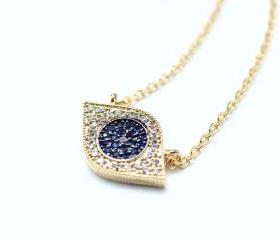 EVIL EYE Pendant Necklace detailed in Swarovski Blue setting Gold